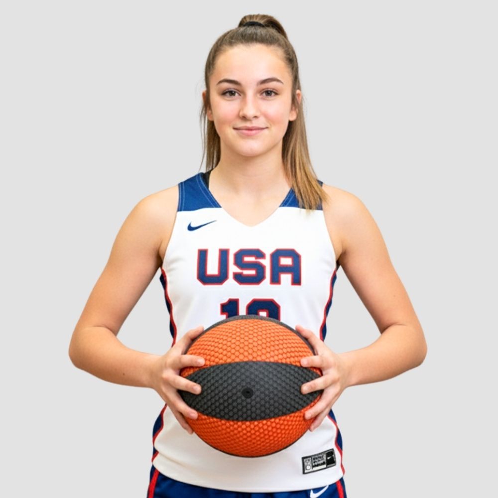 Person wearing a USA basketball jersey holding a HouseHoops Basketball on a gray background