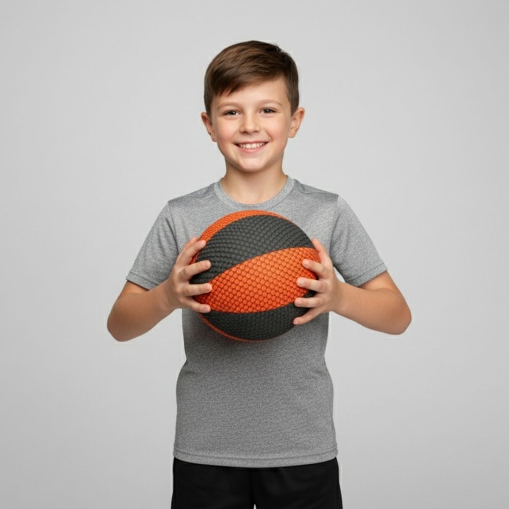 Child holding a HouseHoops Basketball against a plain background