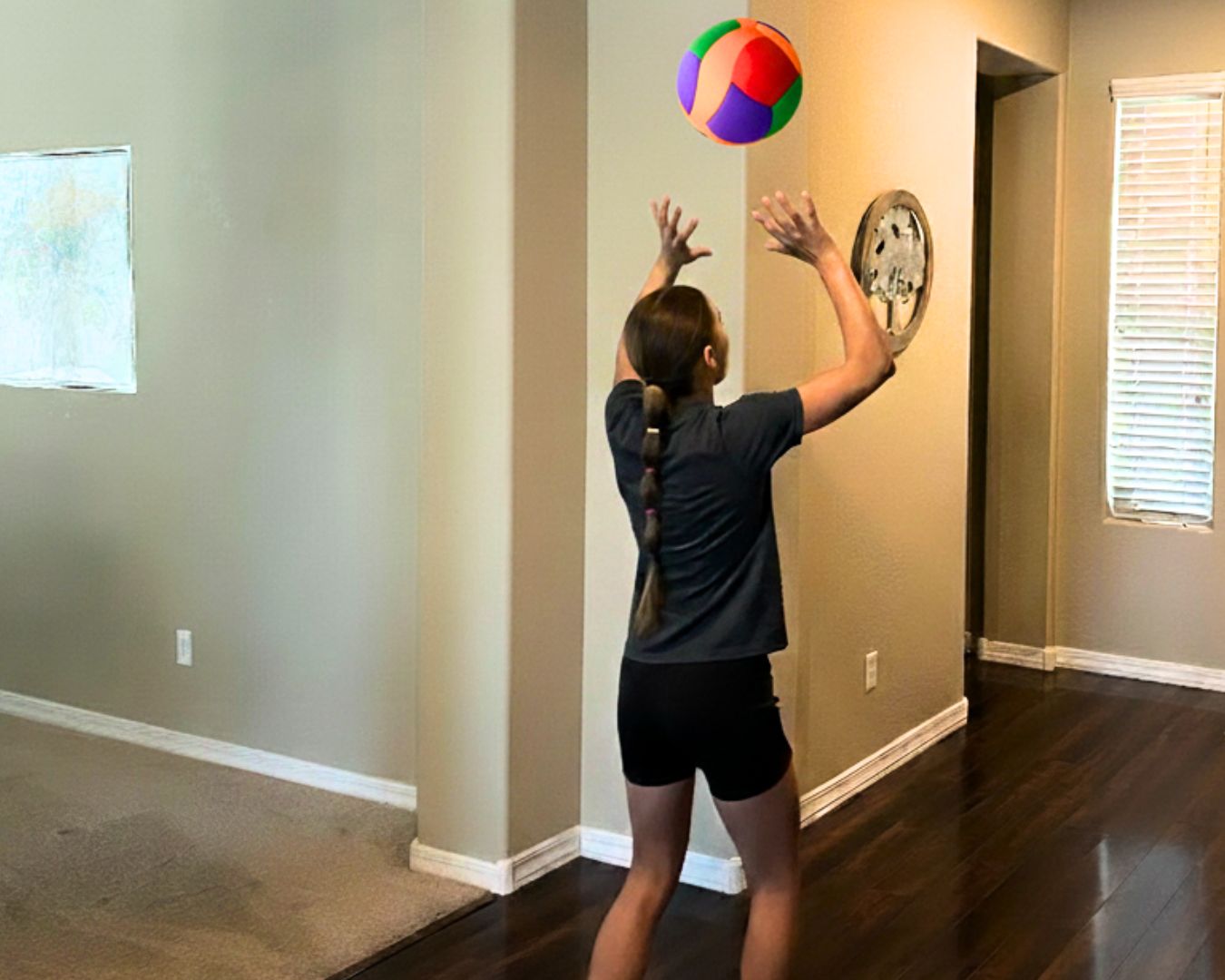 Young girl playing Softy Volleyball at home