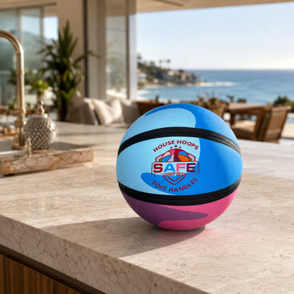 HouseHoops basketball - Soft Handles with Safe Sport Gear logo on a countertop with a scenic background