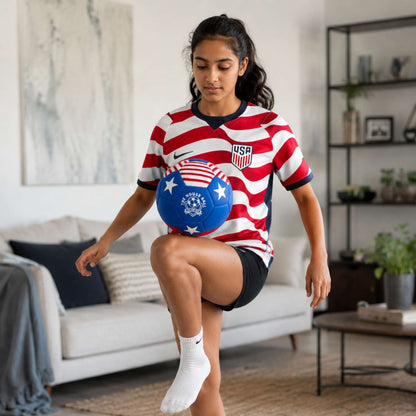 Person wearing a USA soccer jersey with a House Ball - USA in a living room.