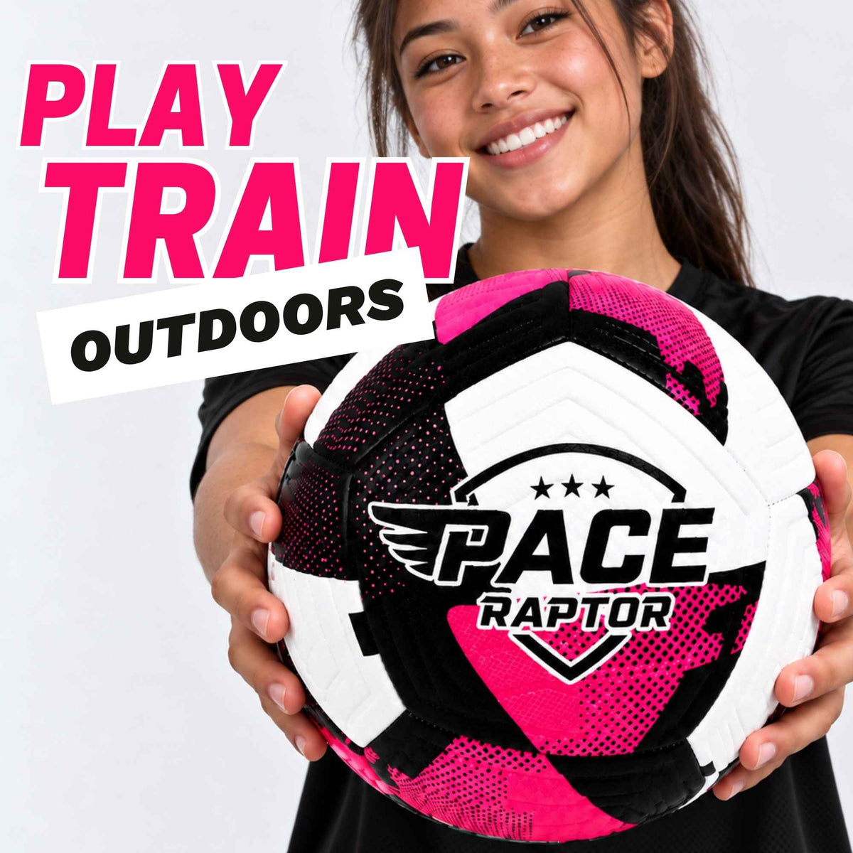 A smiling woman holds a pink soccer ball outdoors against a light gray background, with large text reading 'PLAY TRAIN OUTDOORS' in pink and black. The ball is white, black, and bright pink with a visible 'PACE Raptor' logo.