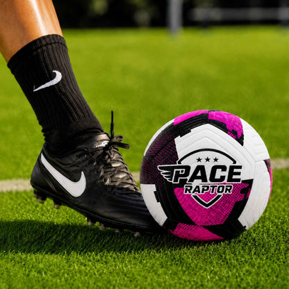 Pace Raptor Size 4 Soccer Ball - Purple with 'Pace Raptor' logo on a grass field, close-up of foot and shoe.