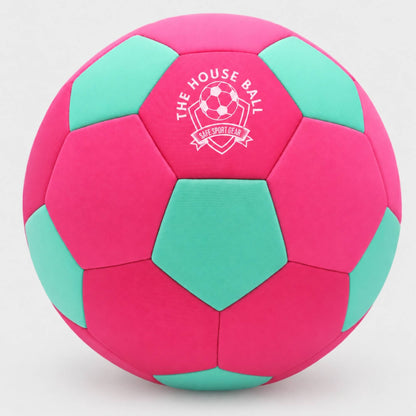 A pink and mint green soccer ball with a white printed logo that reads 'THE HOUSE BALL' and 'Safe Sport Gear' on a light gray background.