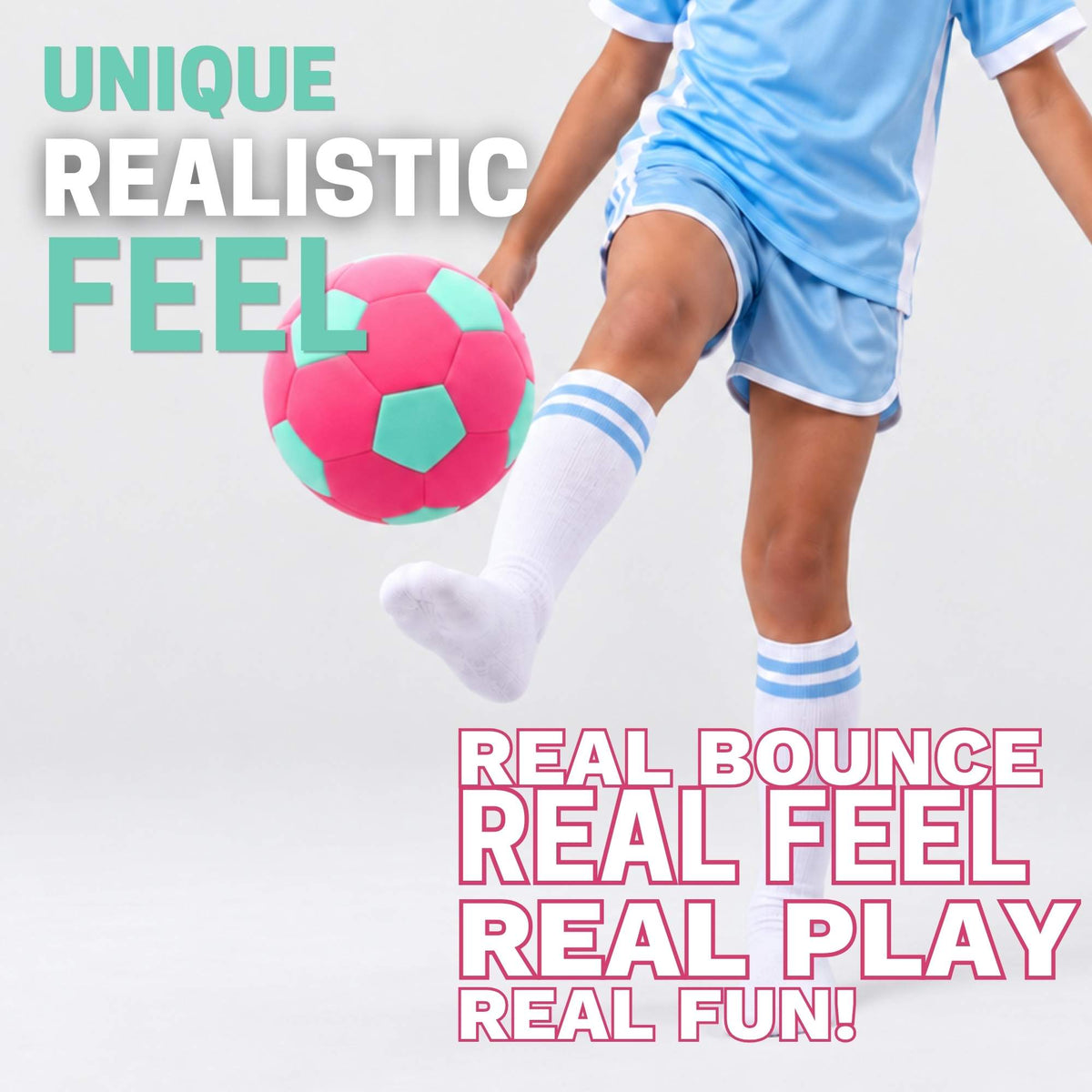A child in a light blue soccer uniform kicks a pink and mint soccer ball against a light gray studio background, with promotional text overlays reading 'UNIQUE REALISTIC FEEL' and 'REAL BOUNCE REAL FEEL REAL PLAY REAL FUN!'.