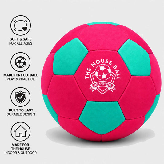 A pink and teal indoor soccer ball with white printed text reading 'THE HOUSE BALL SAFE SPORT GEAR' on the front, shown on a light gray background with four feature icons along the left side.